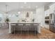 Modern kitchen boasts a large island, stainless steel appliances, and sleek white cabinetry at 2045 Mantle Ridge Dr, Indian Trail, NC 28079