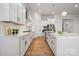 Spacious kitchen features white countertops, ample storage, and stainless steel appliances at 2045 Mantle Ridge Dr, Indian Trail, NC 28079
