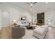 Comfortable living room with a fireplace, contemporary furniture, and ample natural light at 2045 Mantle Ridge Dr, Indian Trail, NC 28079