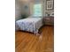 Comfortable bedroom with hardwood floors and a calm, neutral palette at 202 Kenwood Ave, Cherryville, NC 28021