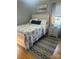 Bedroom featuring a bed with a decorative headboard and patterned rug at 202 Kenwood Ave, Cherryville, NC 28021