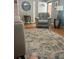 Comfortable living room with a leather recliner and hardwood floors at 202 Kenwood Ave, Cherryville, NC 28021