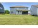 View of backyard featuring a covered porch on a home with blue siding at 256 W Waterlynn Rd, Mooresville, NC 28117