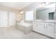Bathroom with tub, dual vanities, and tile floors at 256 W Waterlynn Rd, Mooresville, NC 28117