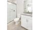 Bathroom features tile floors, white cabinets, and a granite vanity at 256 W Waterlynn Rd, Mooresville, NC 28117