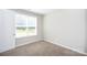 Bedroom with window and carpet flooring at 256 W Waterlynn Rd, Mooresville, NC 28117
