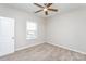 Neutral bedroom featuring plush carpeting, a ceiling fan, and natural light at 256 W Waterlynn Rd, Mooresville, NC 28117
