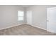 Neutral bedroom with plush carpeting and a window with natural light at 256 W Waterlynn Rd, Mooresville, NC 28117