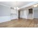 Open dining area features crown molding and built-in cabinets at 256 W Waterlynn Rd, Mooresville, NC 28117