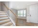 Welcoming entryway with staircase and natural light at 256 W Waterlynn Rd, Mooresville, NC 28117
