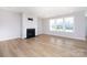 Spacious living room with fireplace and lots of natural light at 256 W Waterlynn Rd, Mooresville, NC 28117