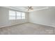 Main bedroom with carpet and ceiling fan at 256 W Waterlynn Rd, Mooresville, NC 28117