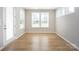 Bright room featuring several windows providing ample natural light and neutral paint at 256 W Waterlynn Rd, Mooresville, NC 28117