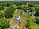 Aerial view showing the property with a home, gazebo, multiple storage sheds, and a long driveway at 2809 N Main St, Kannapolis, NC 28081