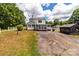 Exterior view of a two-story home featuring a screened-in porch and a long driveway at 2809 N Main St, Kannapolis, NC 28081