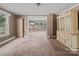 Bright living room featuring ample natural light, built in storage and views of the yard at 2809 N Main St, Kannapolis, NC 28081