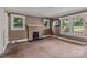 Inviting living room showcasing natural light and a charming fireplace at 2809 N Main St, Kannapolis, NC 28081