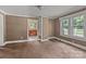 Bright living room featuring large windows and view into the kitchen at 2809 N Main St, Kannapolis, NC 28081