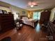 Bedroom with hardwood flooring, ceiling fan, and natural light at 2815 Penny Park Dr, Gastonia, NC 28052