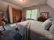 This bedroom has a light blue comforter, carpeted floors and a large closet at 2815 Penny Park Dr, Gastonia, NC 28052