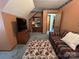 Bonus room featuring a comfortable plaid couch, carpeted floor, and wood dresser at 2815 Penny Park Dr, Gastonia, NC 28052