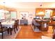 Inviting dining room featuring hardwood floors, wooden chairs, kitchen bar access, and natural light at 2815 Penny Park Dr, Gastonia, NC 28052