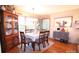 Cozy dining room with hardwood floors, a wood table, and matching wood china cabinet at 2815 Penny Park Dr, Gastonia, NC 28052