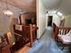 This upstairs hallway has a wood railing, carpeted floors, and multiple skylights at 2815 Penny Park Dr, Gastonia, NC 28052
