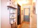 Hallway with laundry room access and decorative shelving, adding character and functionality at 2815 Penny Park Dr, Gastonia, NC 28052