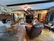 Spacious living room with hardwood floors, a brick fireplace, beamed ceilings, and staircase access at 2815 Penny Park Dr, Gastonia, NC 28052