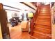 A staircase leads to this inviting living room with wood floors and comfortable seating at 2815 Penny Park Dr, Gastonia, NC 28052