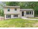 Charming home with a freshly painted brick and siding exterior, complemented by black shutters and well-maintained landscaping at 3121 Revolution Park Dr, Charlotte, NC 28217