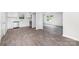 Modern kitchen featuring gray tile floors, stainless steel appliances, white cabinets and quartz countertops at 3121 Revolution Park Dr, Charlotte, NC 28217