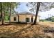 Backyard view of new construction farmhouse-style home with a covered porch at 315 W Hoke W St, Landis, NC 28088