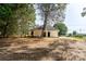 Backyard view of a newly constructed home with a black roof at 315 W Hoke W St, Landis, NC 28088