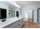 Bright bathroom features a double vanity, large mirror, and modern fixtures with a walk-in shower at 315 W Hoke W St, Landis, NC 28088