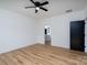 Bright bedroom with wood-look flooring leading to bathroom and closet at 315 W Hoke W St, Landis, NC 28088
