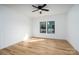 Minimalist bedroom with wood-look flooring and natural light from the large windows at 315 W Hoke W St, Landis, NC 28088