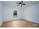 Bedroom featuring a ceiling fan and window overlooking the property at 315 W Hoke W St, Landis, NC 28088