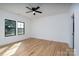 Bright and airy bedroom features wood-look flooring and large windows at 315 W Hoke W St, Landis, NC 28088