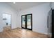 Light filled dining room with hardwood floors and French doors that bring the outdoors in at 315 W Hoke W St, Landis, NC 28088