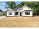 Beautiful new construction home with modern farmhouse design and professional landscaping at 315 W Hoke W St, Landis, NC 28088