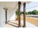 Front porch with wooden pillars, black trimmed windows, and a view at 315 W Hoke W St, Landis, NC 28088