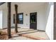 Home's charming front porch with brick accents and wooden pillars at 315 W Hoke W St, Landis, NC 28088