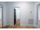 Hallway leading to bathroom with black door and white trim at 315 W Hoke W St, Landis, NC 28088