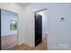 Hallway showcases wood-look flooring with contrasting doors to the rooms at 315 W Hoke W St, Landis, NC 28088