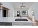 Modern kitchen featuring a quartz countertop with a sink, stainless appliances, and wood floors at 315 W Hoke W St, Landis, NC 28088