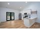 Modern kitchen with stainless steel appliances and bright, white cabinets at 315 W Hoke W St, Landis, NC 28088
