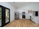 Bright kitchen features stainless steel appliances, white cabinets and wood floors at 315 W Hoke W St, Landis, NC 28088