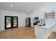 Bright kitchen features stainless steel appliances, white cabinets and wood floors at 315 W Hoke W St, Landis, NC 28088